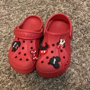 Red kids crocs size 12. Comes with croc charms.